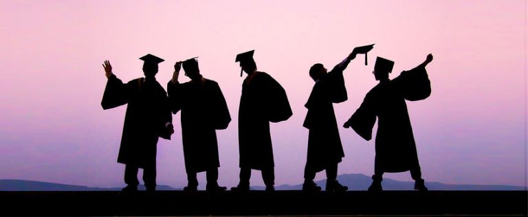 Silhouettes of graduates celebrating, representing success in completing HND and Diploma courses.