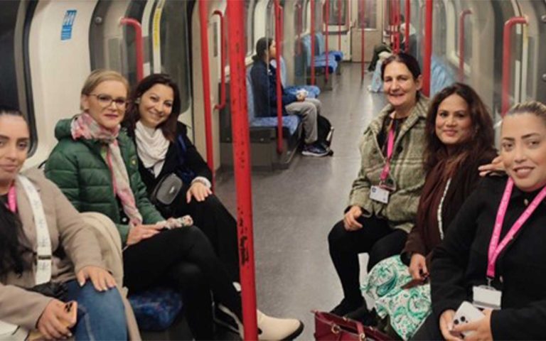 Group of women traveling on the London Underground for the Exploring Career Pathways – Stratford Job Show.