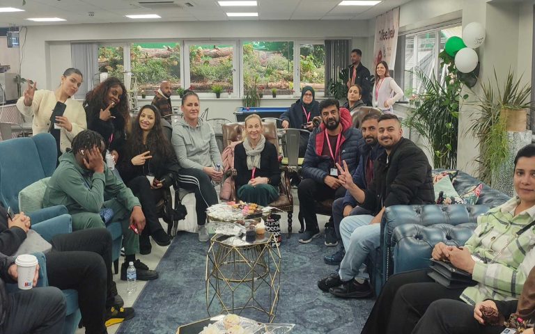 Attendees gathered and smiling during the October Monthly Meeting Café – Fostering Confidence at Mont Rose College.