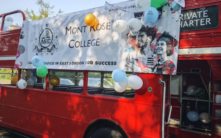 A decorated red double-decker bus adorned with balloons and a Mont Rose College banner for the Mont Rose College Graduation Ceremony 2024.