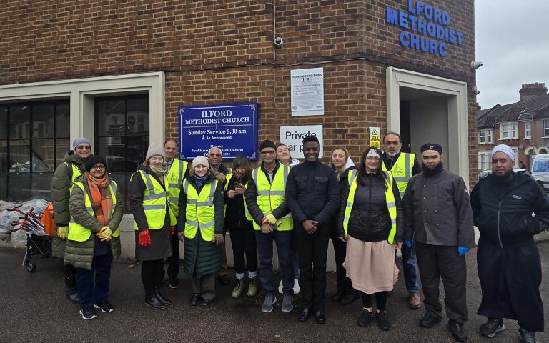 Volunteers and MRC students gather outside Ilford Methodist Church in high-visibility vests, participating in a Greener Ilford Lane litter-picking initiative