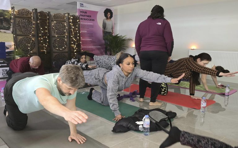 Participants practicing balance and core exercises during Yoga at Mont Rose College, fostering mindfulness and well-being in a serene setting.