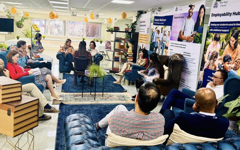 A group discussion in a cozy, book-filled setting at Mont Rose College, celebrating World Book Day with engaging conversations.