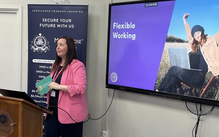 A woman presents a talk on flexible working at Mont Rose College for International Women’s Day celebration.