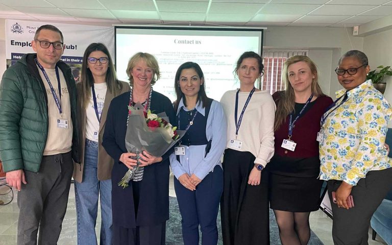 Group photo with Jennifer Holloway holding flowers after speaking at the Jennifer Holloway Inspires Students at Employability Seminar.