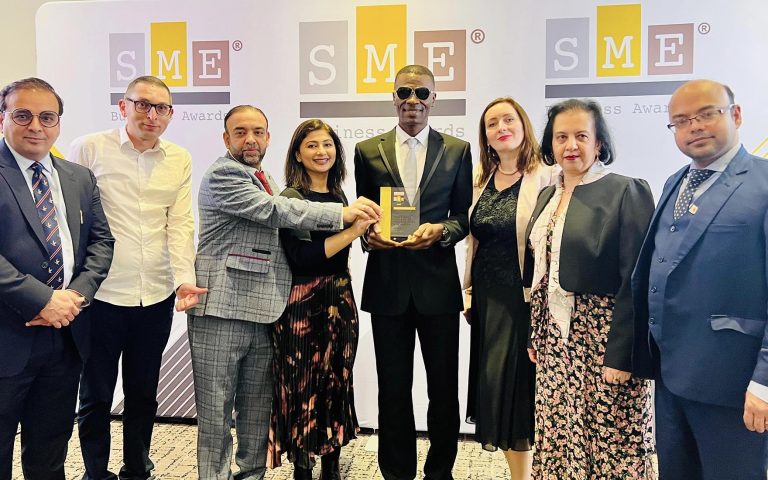 Mont Rose College representatives celebrating their achievement at the SME London Chamber of Commerce Awards, holding a prestigious award.
