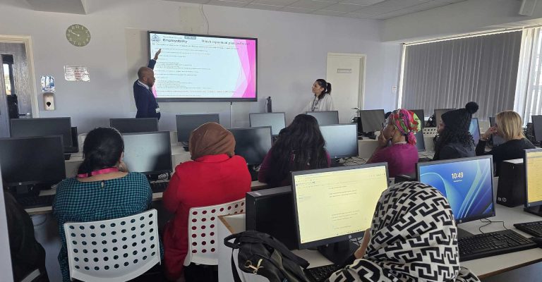Students attending the Student Finance Repayment Workshop – Empowering Students for a Successful Career Path in a computer lab setting.