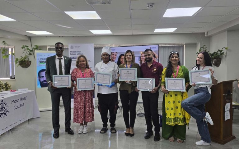 Group of Angel Competition participants proudly holding certificates at Mont Rose College during the award ceremony celebration.