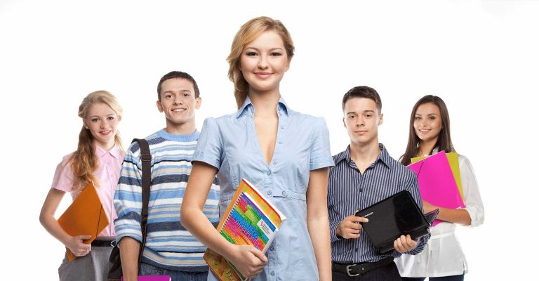 Group of students holding books and folders, representing the comparison between HND vs HNC study options.