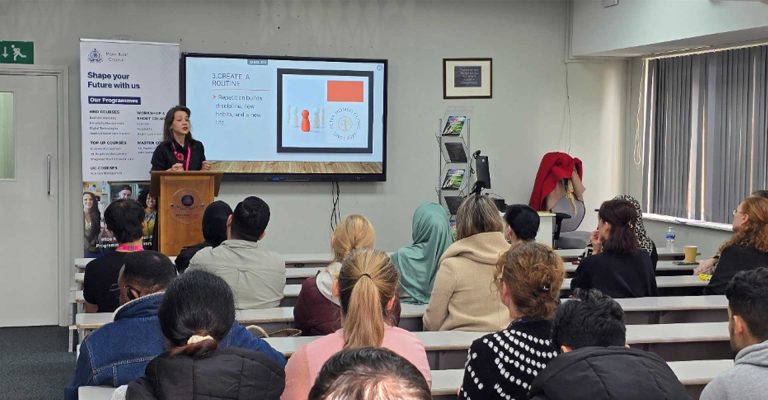 Petya Ikonomova delivering a motivational talk at Mont Rose College to a classroom of engaged students.