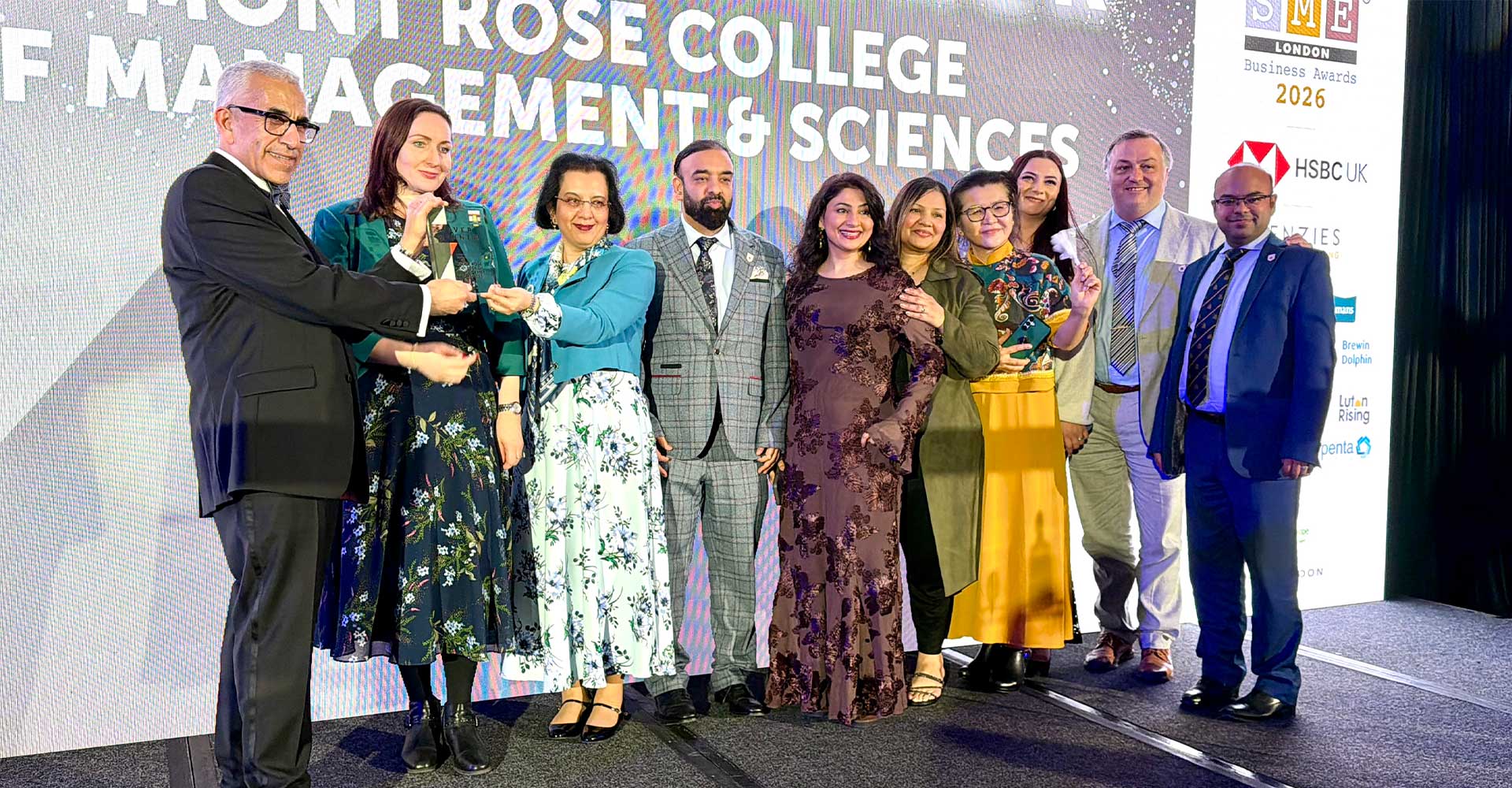 Mont Rose College team receiving recognition on stage at the Mont Rose College CSR Award 2026, celebrating achievement and community impact.