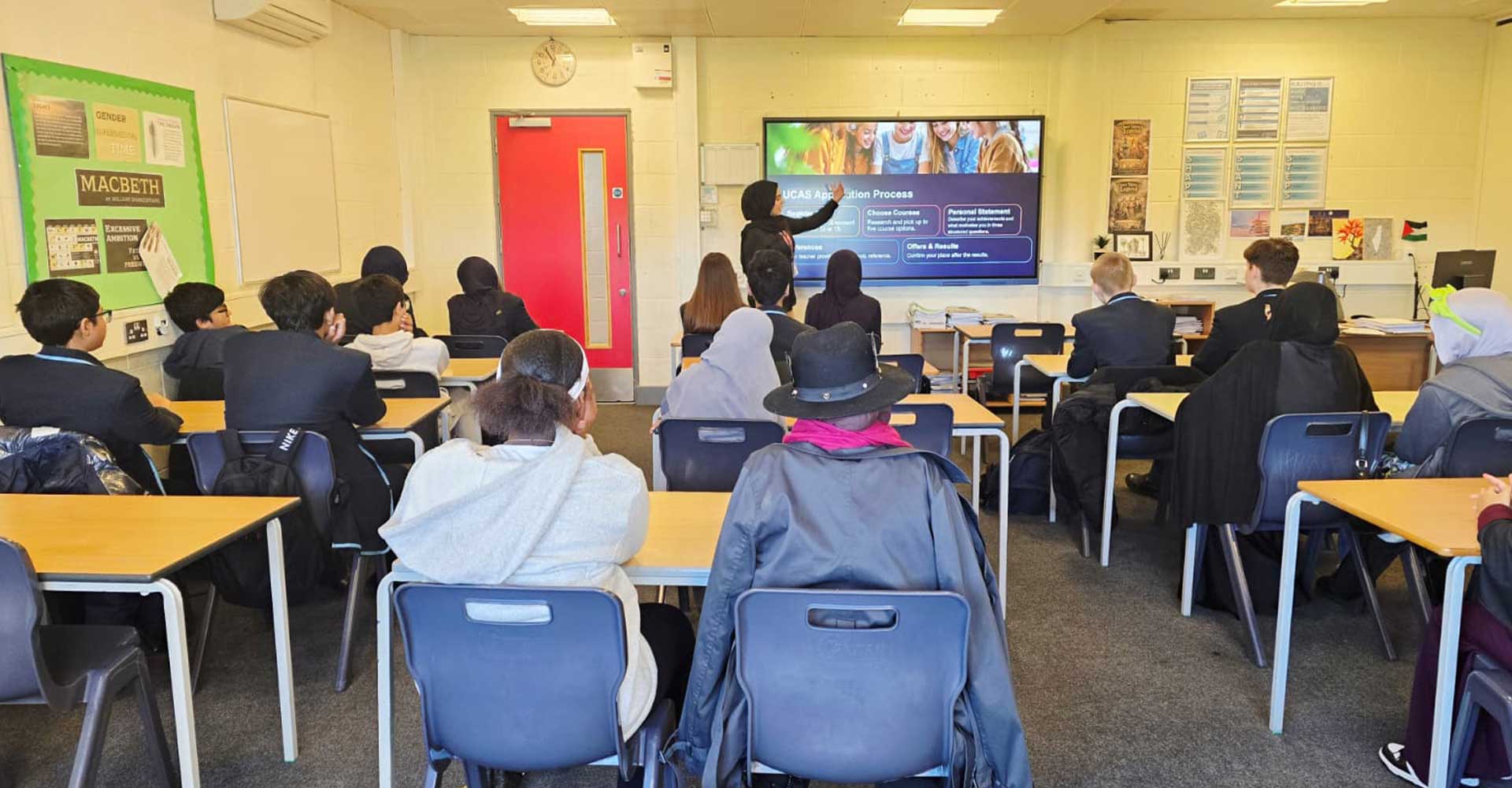 Students in classroom presentation at Cumberland School, Mont Rose College inspires students session with UCAS guidance on screen