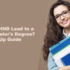 Student holding books and study materials, exploring pathways from HND to bachelor's degree through a university top-up programme.