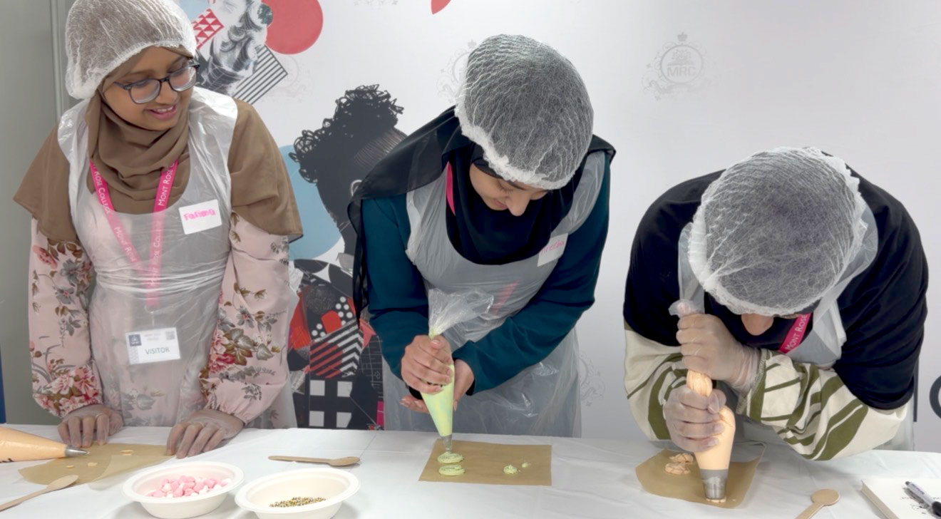 Students develop practical cake decorating skills during a hands-on hospitality workshop at Mont Rose College.