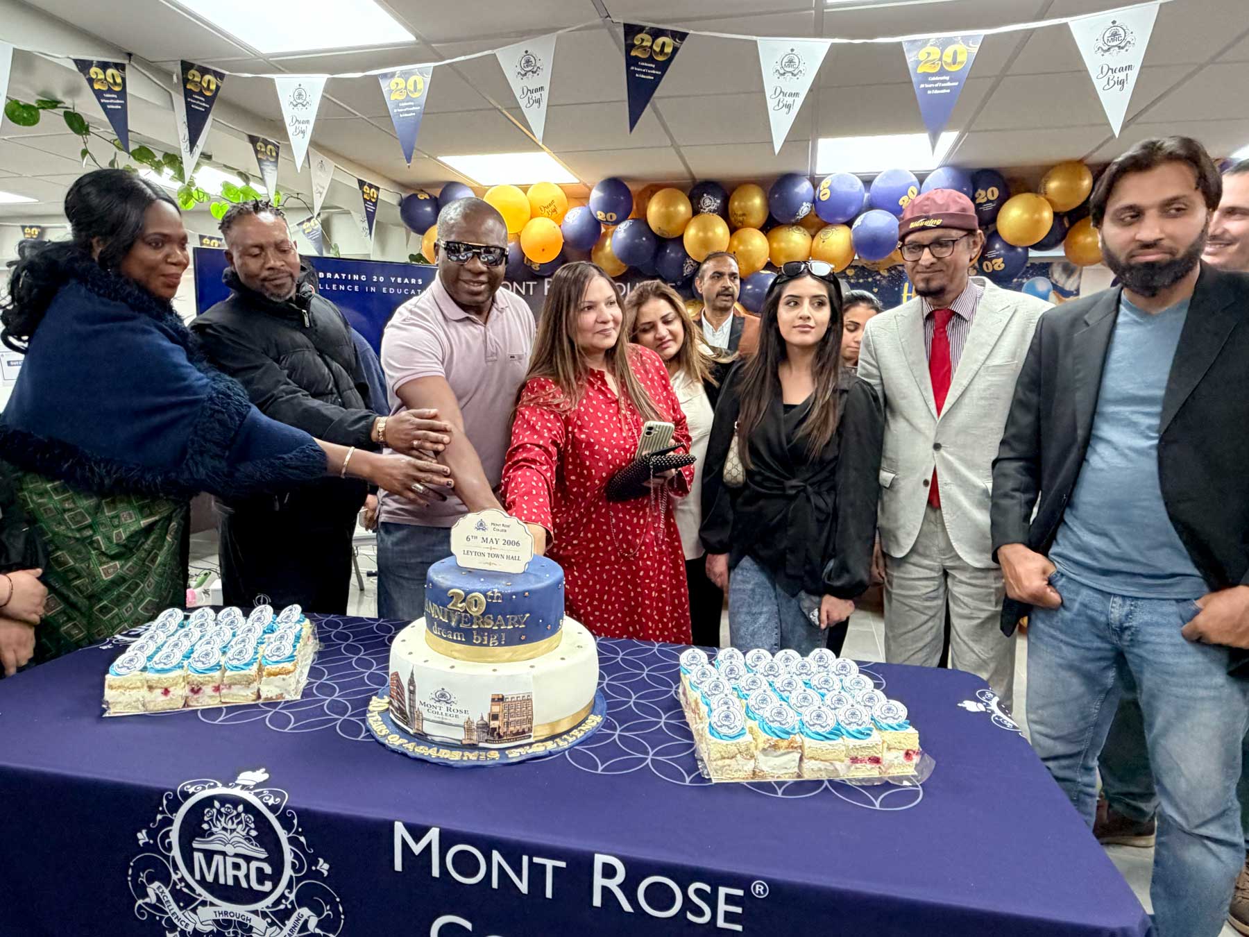 Cake cutting ceremony during the Mont Rose College 20th Anniversary celebration